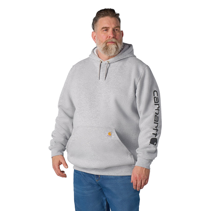 Heather gray Carhartt pullover hoodie with hood and vertical sleeve logo, worn on model.
