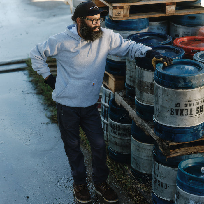 Heather gray Carhartt hoodie with hood and vertical sleeve logo, long sleeves.