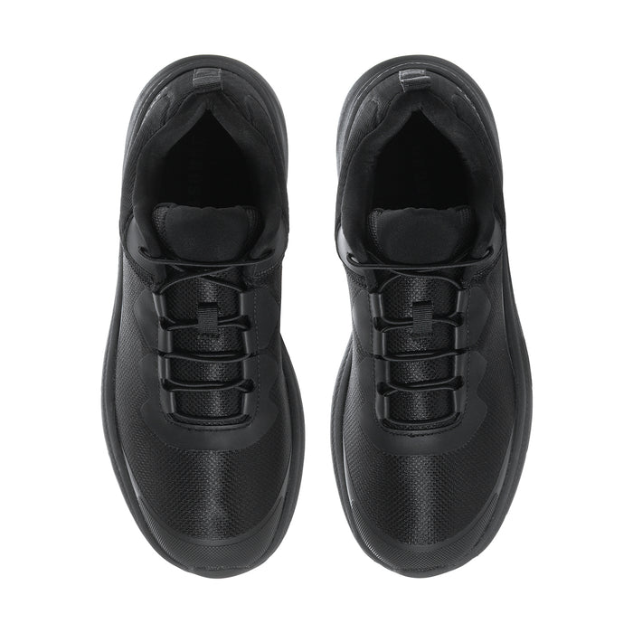 Pair of men's black sneakers, front view with lace-up straps and cushioned tongue