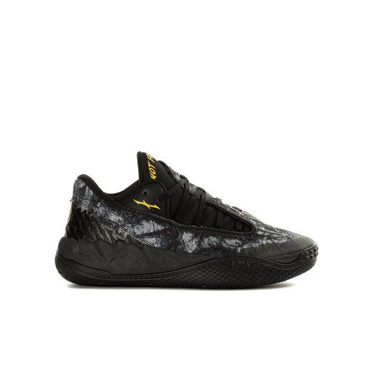Youth black low-top sneaker with lace-up front and textured side panels, yellow logo
