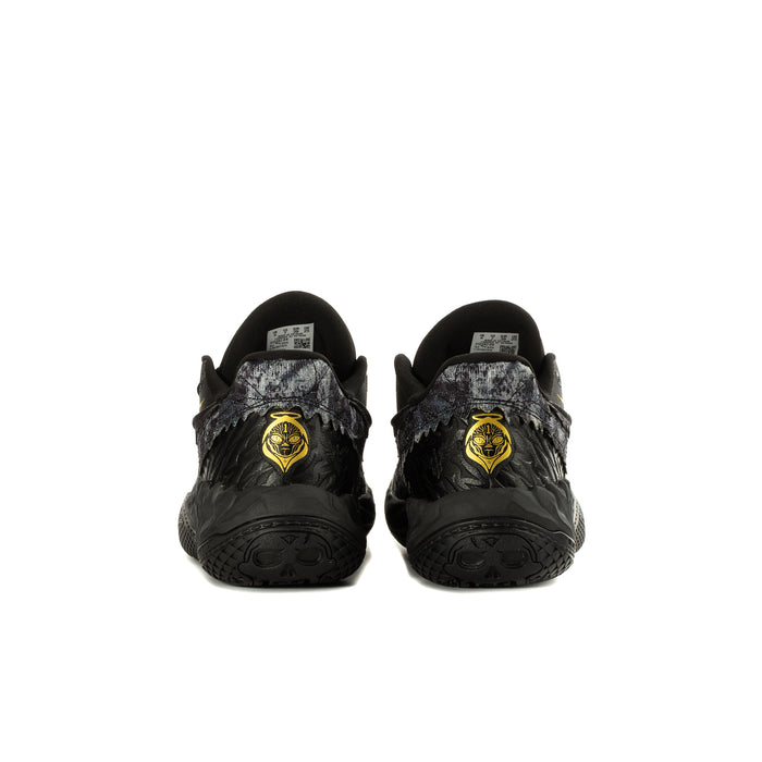 Youth black sneaker pair with gold emblem on heel and patterned side panels