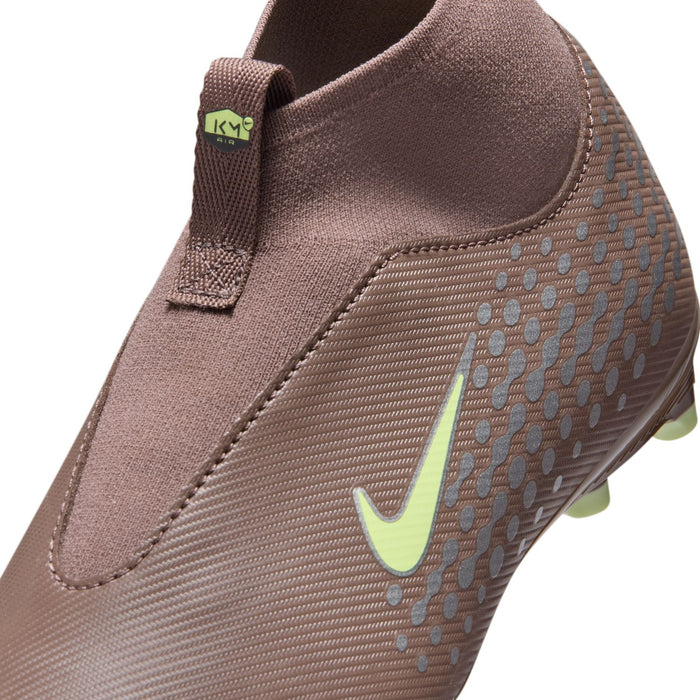 Youth plum soccer cleat close-up showing textured upper, green Nike swoosh, stitched edge