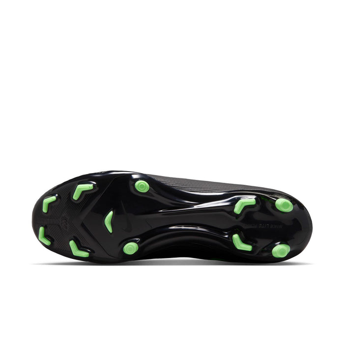 Bottom view of black soccer cleat outsole with neon green studs for FG/MG