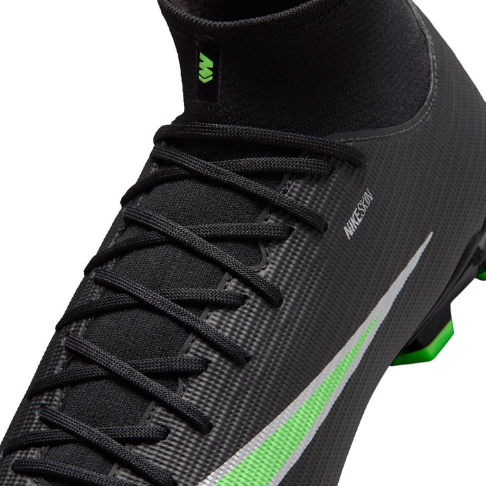 Close-up of black mens cleat upper with neon green laces accents and Nike logo