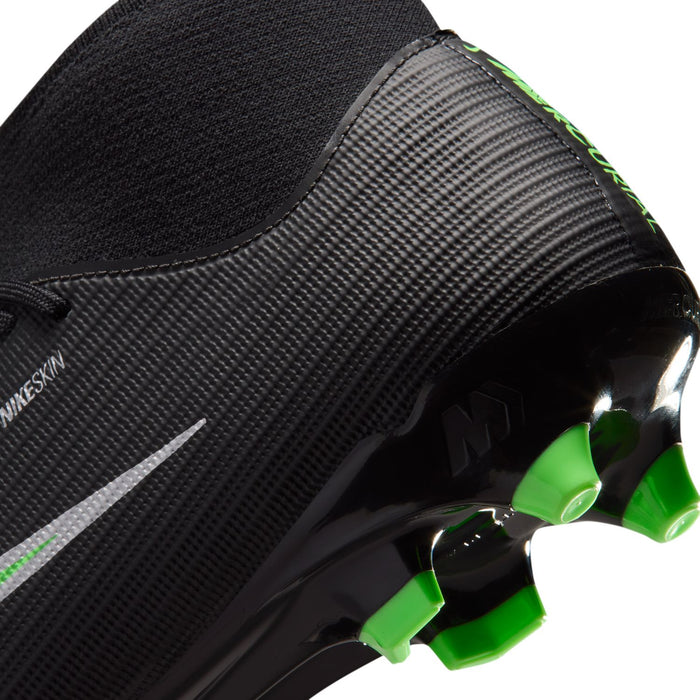 Side close-up of black mens soccer cleat with neon green details and molded studs