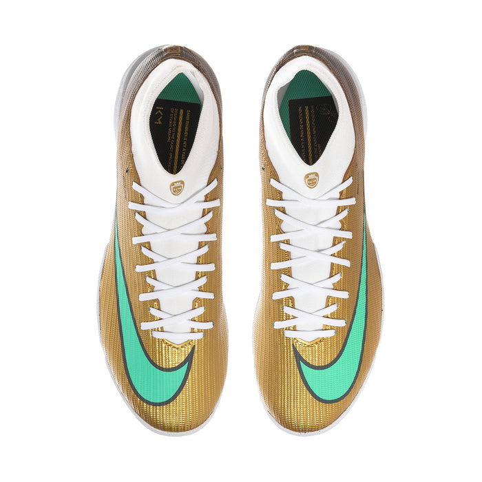 Men's TF soccer cleat pair, metallic gold uppers with teal details, white laces