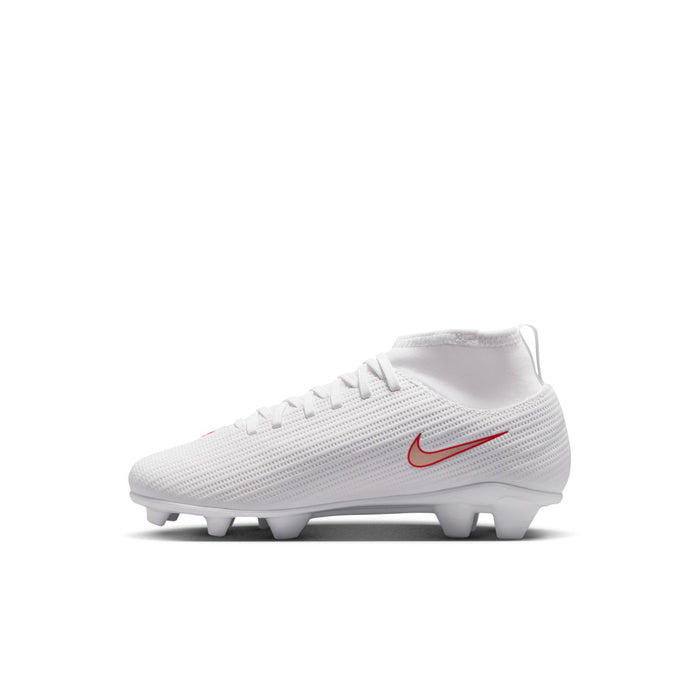 Kids white soccer cleat angled side view with red swoosh and firm ground studs