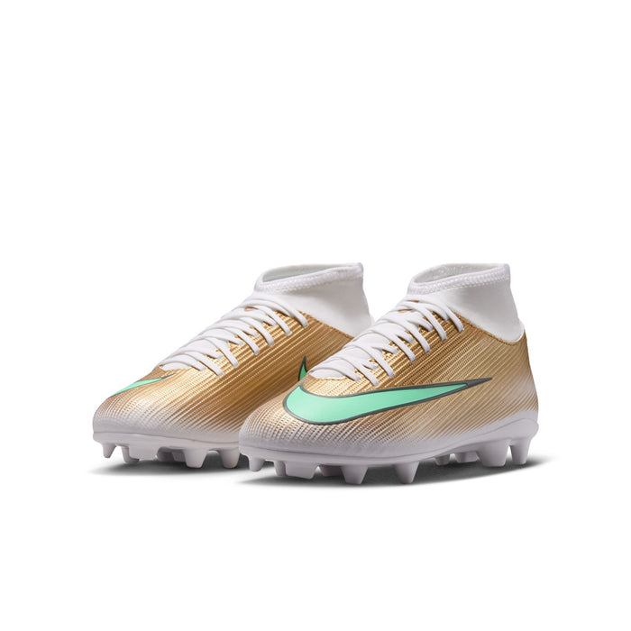 Youth soccer cleats pair with gold upper, green swoosh, white laces, and studs.
