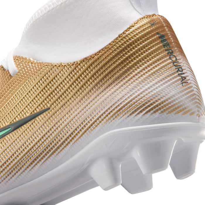 Youth soccer cleat heel close-up with gold texture and white studded outsole.