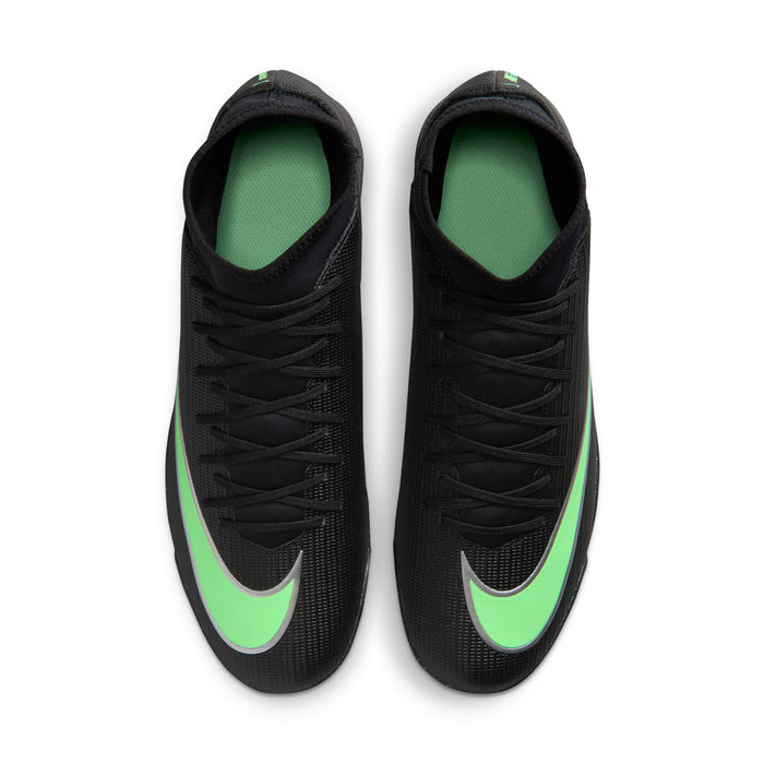 Men's black turf soccer cleats with neon green sockliner lining visible at opening