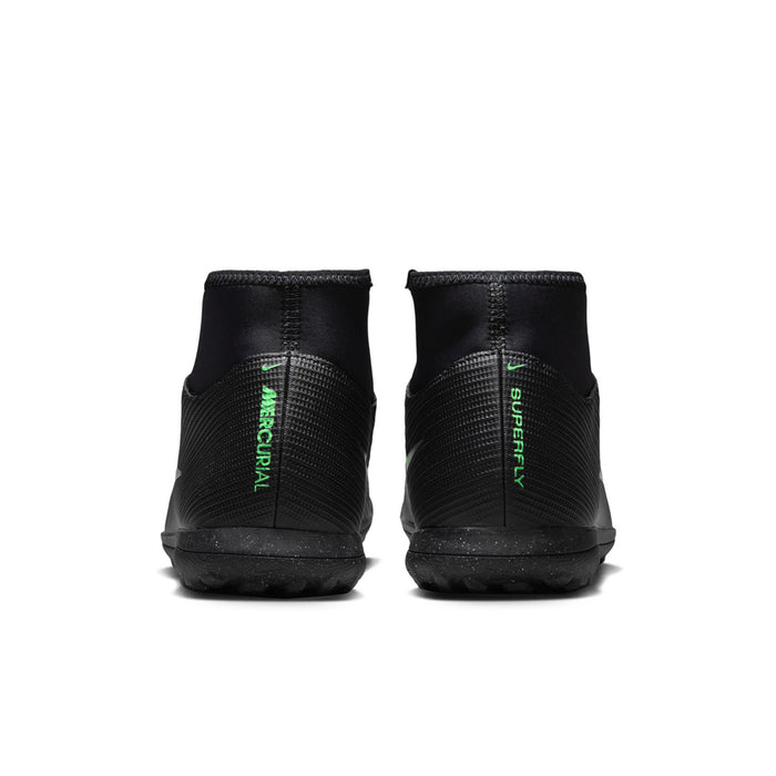Men's black turf soccer cleats with green logo on heel and textured back panel