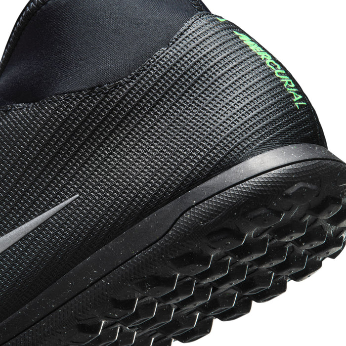 Men's black cleat outsole with molded studs and neon green trim on upper edge