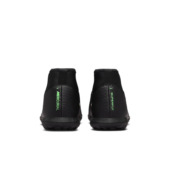 Youth turf soccer cleats with black heel and neon green heel text