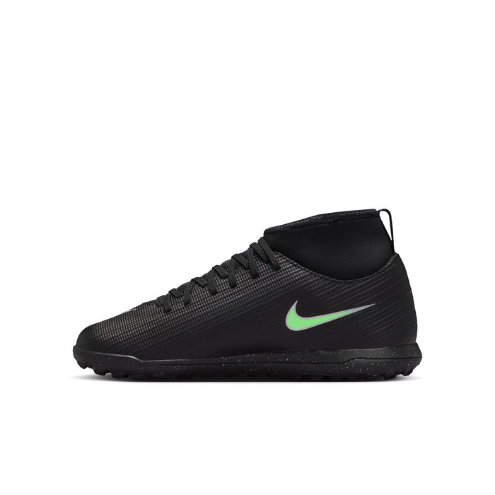 Youth soccer cleats, black textured upper with neon green Swoosh
