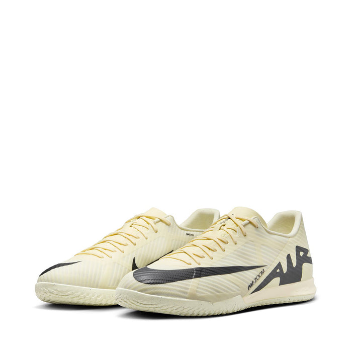 Pair of men's cream soccer cleats with black accents and lace-up uppers