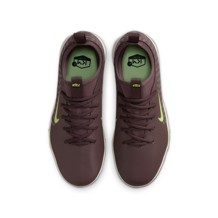 Pair of youth plum soccer cleats with neon-green accents and lace-up front