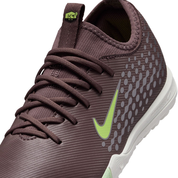 Close-up of youth plum soccer cleat laces with dotted texture and green swoosh