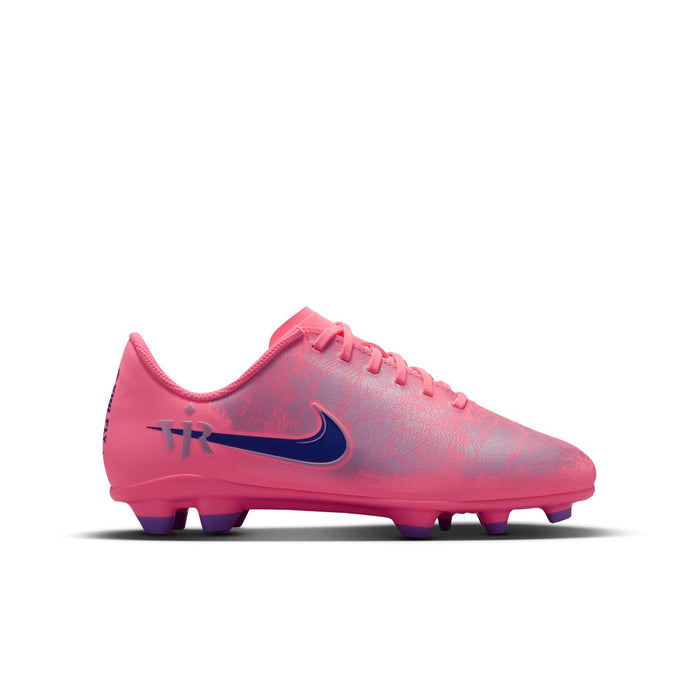 Youth pink soccer cleat side view with dark navy swoosh and purple studs
