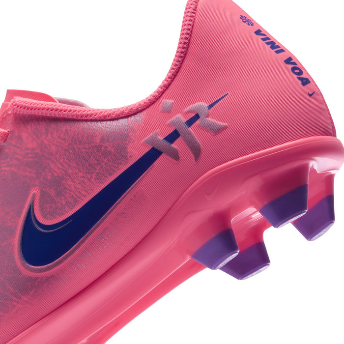 Youth pink soccer cleat with dark navy swoosh and purple outsole studs