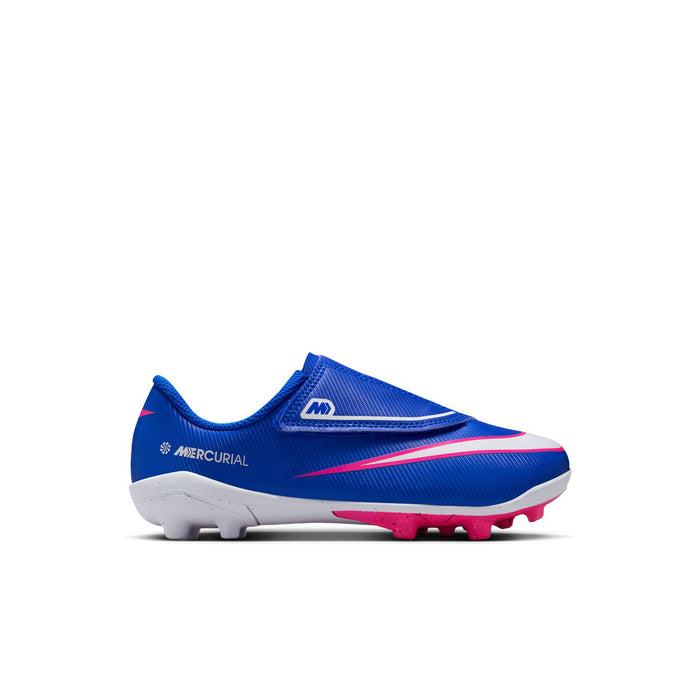 Kids blue soccer cleat with pink swoosh, white accents, and studded outsole
