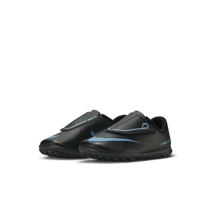 Kids soccer cleat shoe, black with blue stripes and Nike swoosh, side view