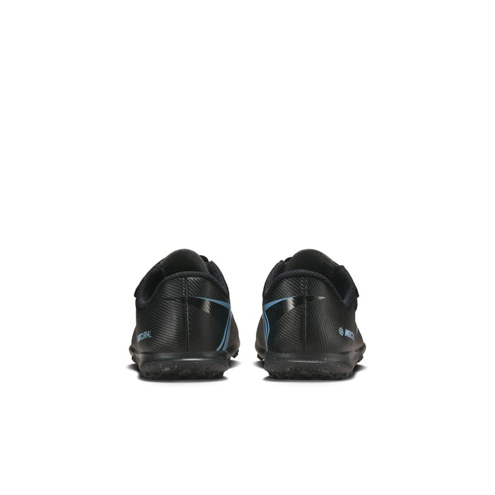 Pair of kids soccer cleat shoes, black heels with blue trim, rear view