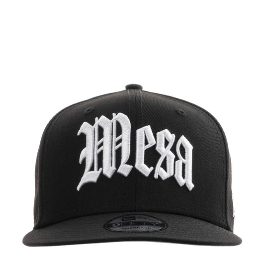 Black baseball cap with white front logo and curved brim