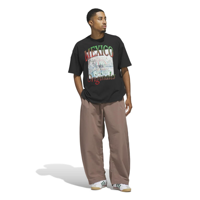 Men's black T-shirt with 'MEXICO Originals' graphic, side view on model