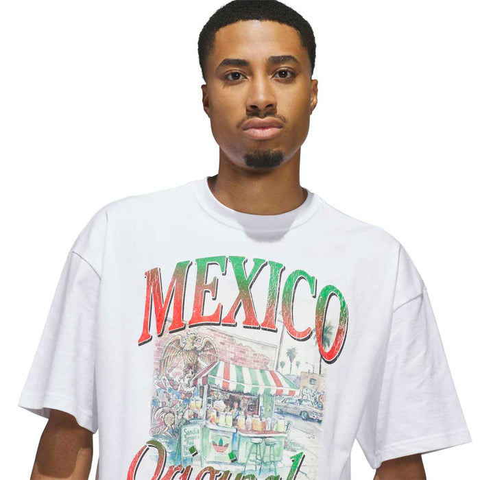 Men's white t-shirt close-up: 'MEXICO' and 'Originales' multicolor print