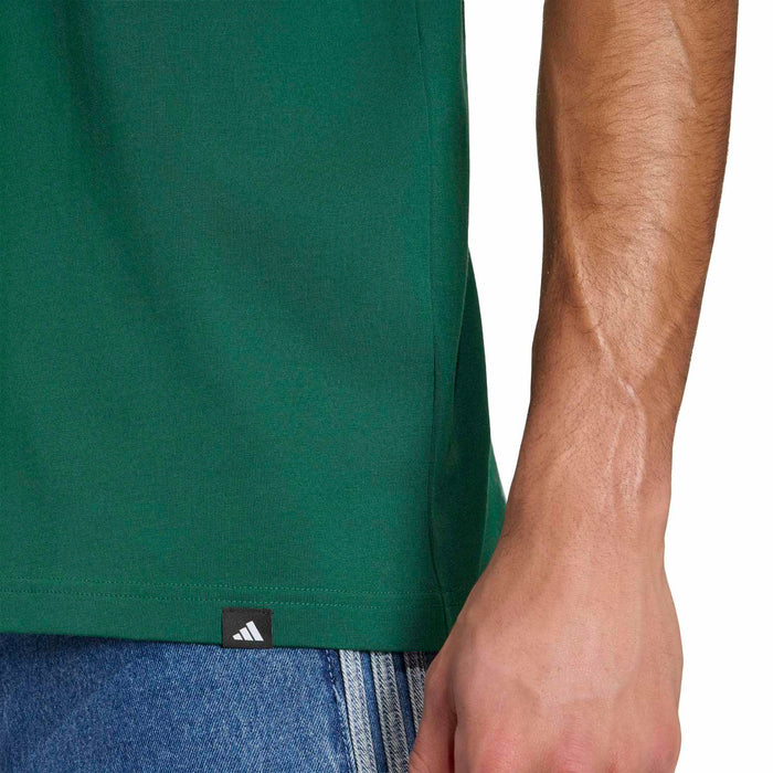 Green crewneck T-shirt hem with small black logo label