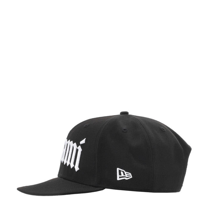 Black baseball cap with white logo text and small New Era flag