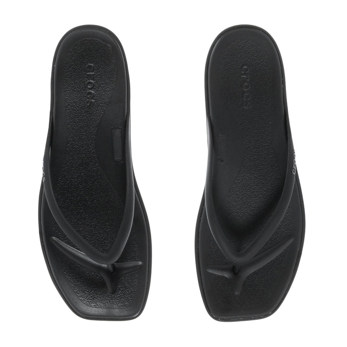 Women's black flip-flop sandals, top view of two textured footbeds