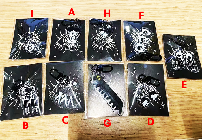 Mini Keychain by Abao, featuring cartoon characters on black plastic bags. Preorder now, shipping in Aug 2024.
