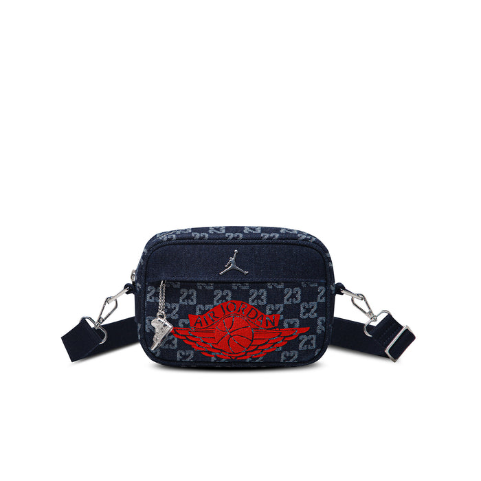 Dark indigo mini camera bag with red logo, zip top, crossbody straps