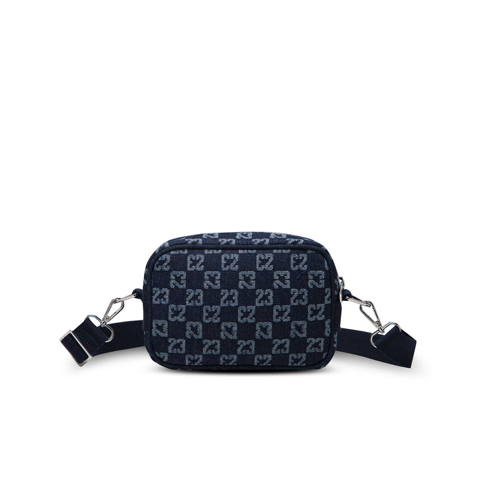 Dark indigo front camera bag with repeating pattern, zip closure, side rings
