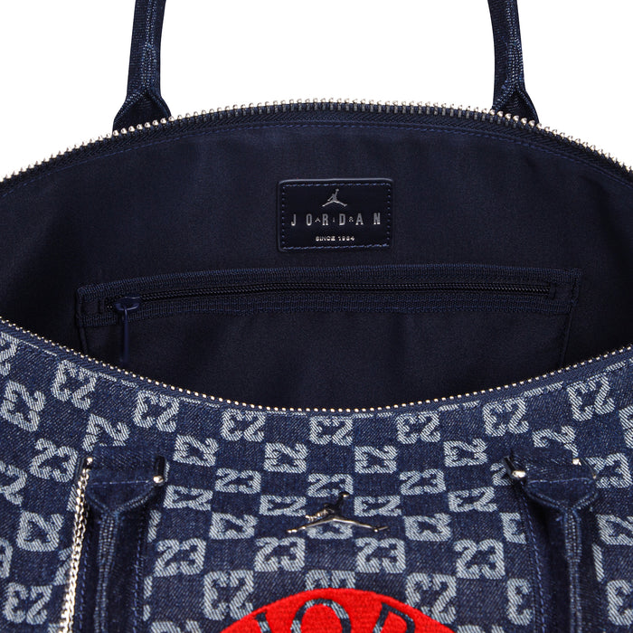 Dark indigo monogram duffle bag interior with JORDAN label and zipper