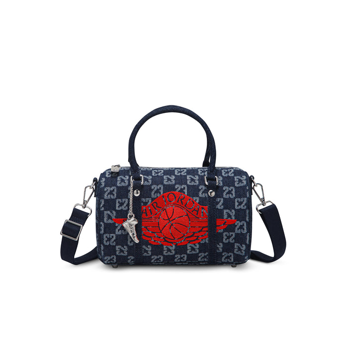 Dark indigo monogram mini duffle bag with red emblem, top handles, and side straps