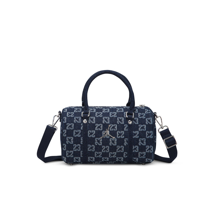 Dark indigo monogram mini duffle bag with red emblem, zip top, and crossbody straps