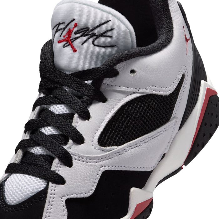 White and black youth sneaker with red Jumpman logo on tongue and black lace-up