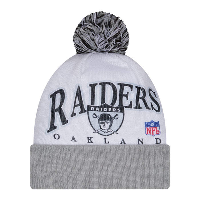 White and gray knit beanie with dark pom and Raiders graphic on front