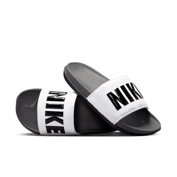 Men's slide sandals with white upper strap, black Nike text, dark grey footbed