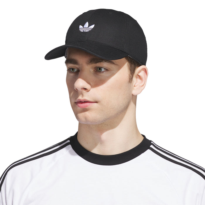 Black strapback baseball cap with white trefoil logo, worn by model