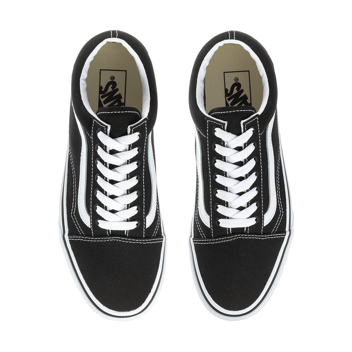 Men's black sneaker interior view with white laces and Vans logo on tongue lining