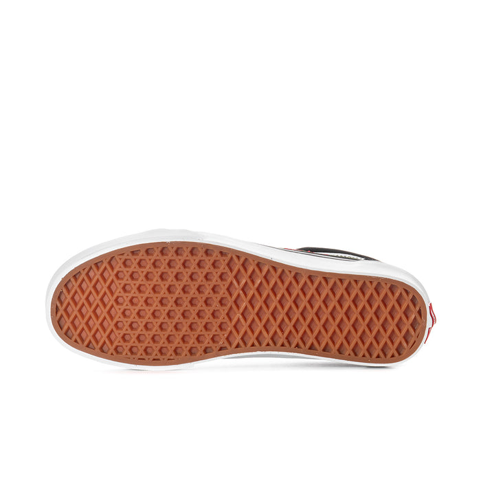 Men's low-top sneakers outsole with white edge and brown gum tread.