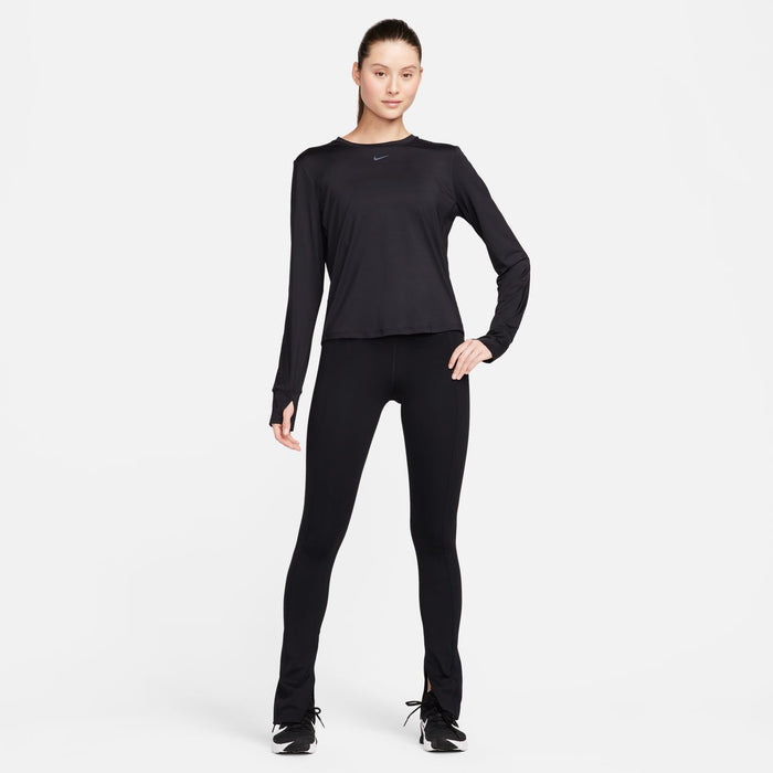 Women's black long-sleeve Dri-FIT top with Nike swoosh, worn with leggings