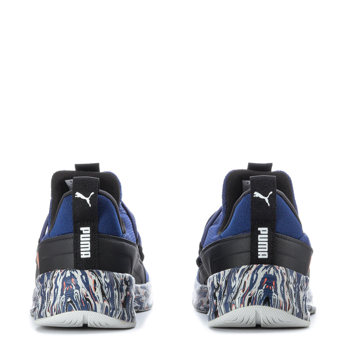 Blue youth sneakers with black heel pull tab, zebra-pattern midsole, red Puma logo