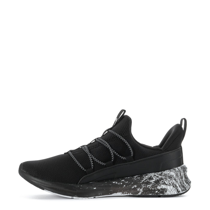 Black youth sneaker, lace-up straps and white speckled sole with sculpted side