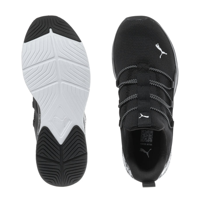 Black and white shoe sole view, tread on outsole and PUMA logo on upper