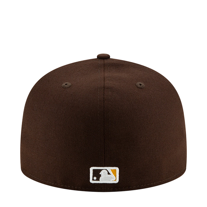 Brown baseball cap back panel with white logo patch