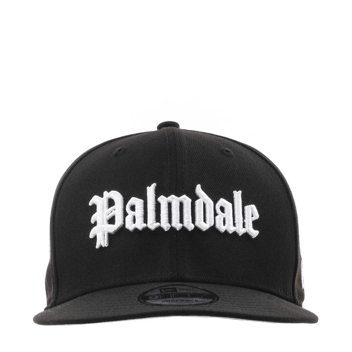 Black baseball cap with white script logo on the front and flat brim